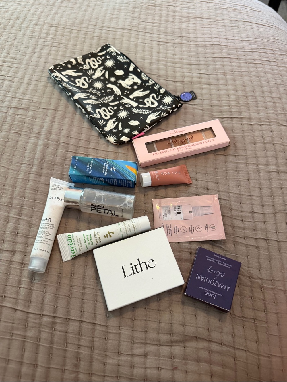 Mystery makeup bag with 5-8 pieces of new sealed, unexpired pieces of makeup
